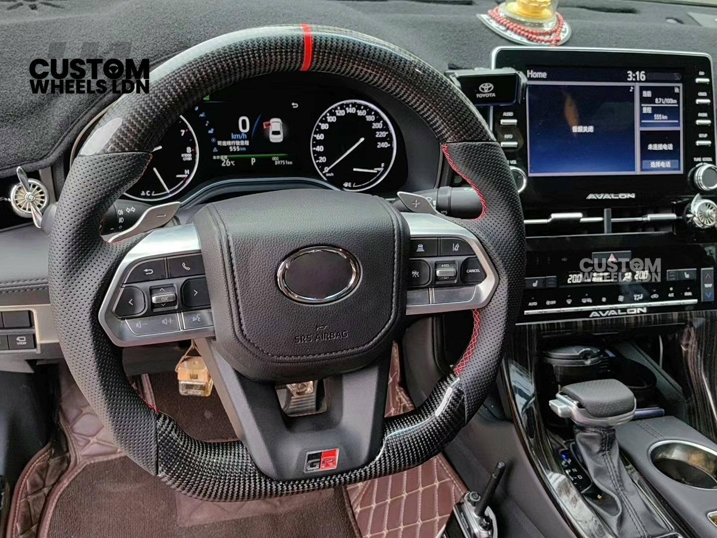 Toyota Custom GR Steering Wheel – Carbon Fiber, Flat Bottom, Red Center Stripe, Perforated Grips | Fits Yaris GR, Corolla GR + More | Plug & Play | Sporty Upgrade with Paddle Cutouts | Track-Inspired Retrofit