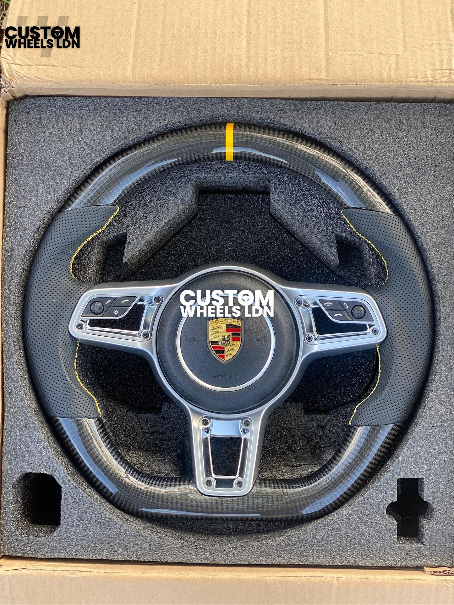 Porsche Custom Flat Bottom Steering Wheel – Gloss Carbon Fibre, Perforated Leather, Yellow Stitching & Stripe | Fits 991, 997, 981, 718, Boxster, Cayman, Macan, Panamera + more | Plug & Play | With Airbag | Upgrade for Older Models Available