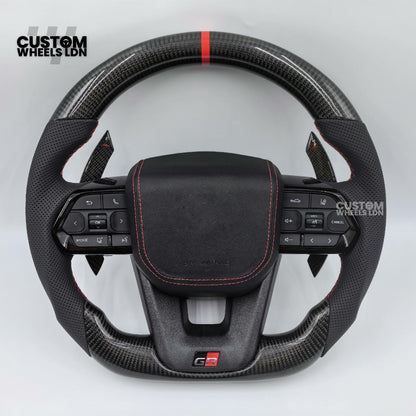 Toyota Custom GR Steering Wheel – Carbon Fiber, Flat Bottom, Red Center Stripe, Perforated Grips | Fits Yaris GR, Corolla GR + More | Plug & Play | Sporty Upgrade with Paddle Cutouts | Track-Inspired Retrofit