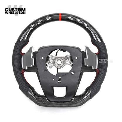 Toyota Custom Hilux Flat Bottom Steering Wheel – Carbon Fiber & Perforated Leather with Red Center Stripe | Fits 2021+ Hilux Models | Plug & Play | Premium Upgrade for Off-Road & Daily Driving | Made to Order | Performance Look & Feel