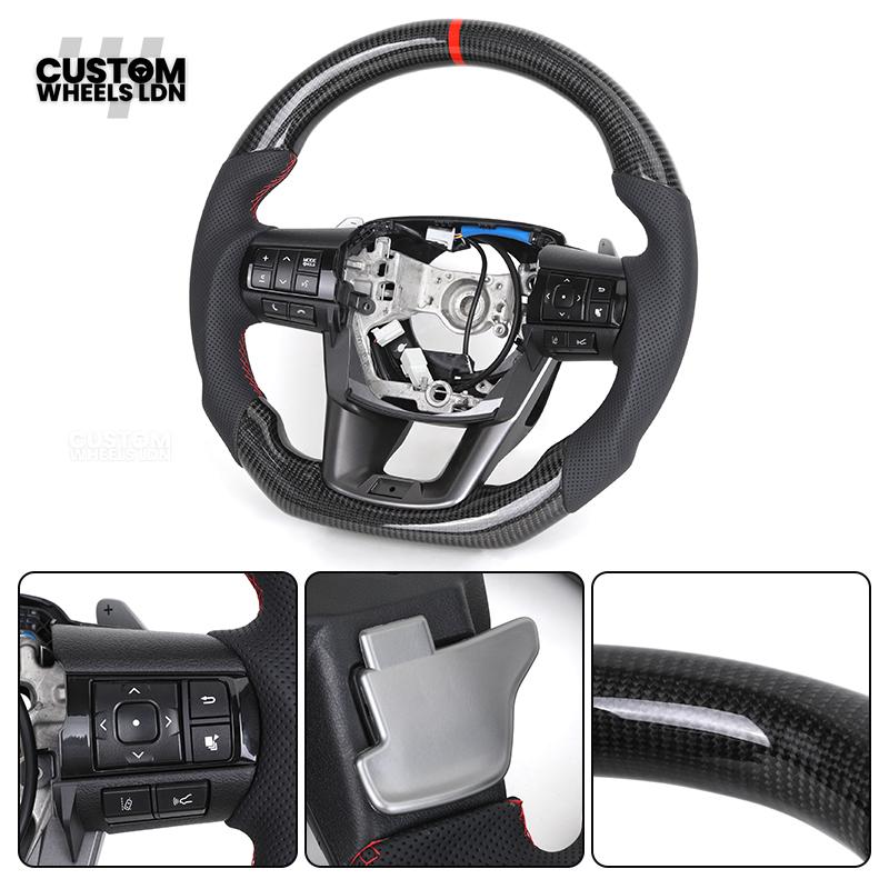 Toyota Custom Hilux Flat Bottom Steering Wheel – Carbon Fiber & Perforated Leather with Red Center Stripe | Fits 2021+ Hilux Models | Plug & Play | Premium Upgrade for Off-Road & Daily Driving | Made to Order | Performance Look & Feel