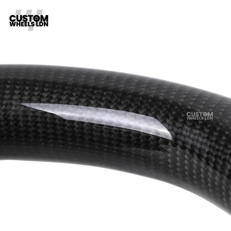 Toyota Custom Hilux Flat Bottom Steering Wheel – Carbon Fiber & Perforated Leather with Red Center Stripe | Fits 2021+ Hilux Models | Plug & Play | Premium Upgrade for Off-Road & Daily Driving | Made to Order | Performance Look & Feel