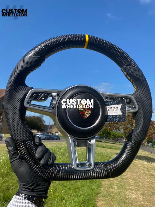 Porsche Custom Flat Bottom Steering Wheel – Gloss Carbon Fibre, Perforated Leather, Yellow Stitching & Stripe | Fits 991, 997, 981, 718, Boxster, Cayman, Macan, Panamera + more | Plug & Play | With Airbag | Upgrade for Older Models Available